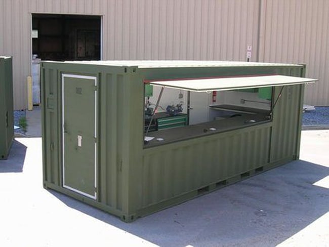A green container converted into a workshop.