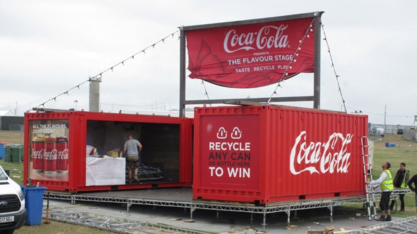 A container painted red with the Coca Cola logo.